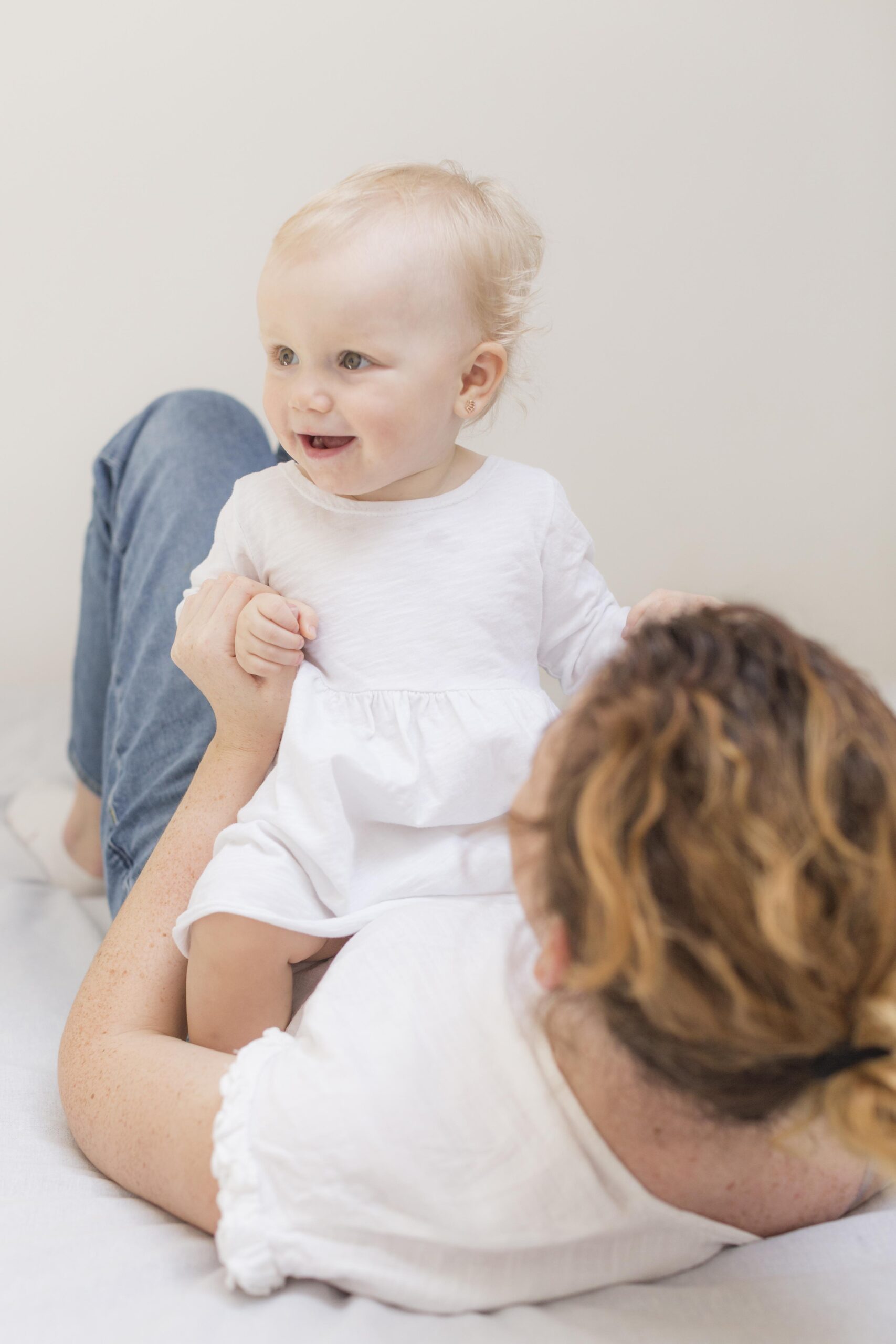 adorable-baby-girl-playing-with-mother